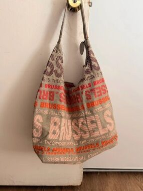 Robin Ruth Beige Canvas Hobo with Orange and Brown Text
